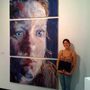 Jessica with Face and awards at SDSU Art Gallery