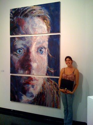 Jessica with Face and awards at SDSU Art Gallery